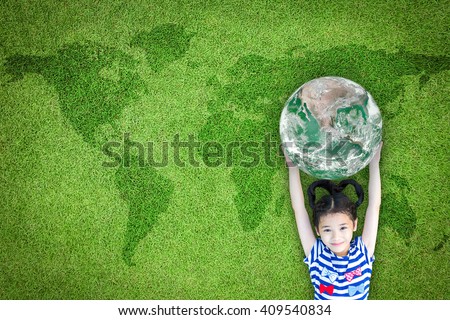 Happy young girl child kid raising green planet earth on grass ground lawn nature background: World sustainable environment CSR ESG eco bio friendly concept: Element of this image furnished by NASA
