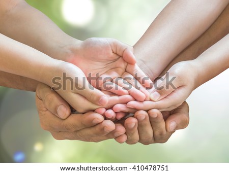 Family prayer hands in empty open palm gesture praying together isolated on green natural bokeh background with clipping path: Father support daughter son spiritual pray for peace of mind CSR concept