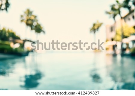 Blur abstract background vintage style resort hotel swimming pool reflective water surface, blue cool clear sky, coconut palm tree row: Blurry perspective view vacation summer holiday relaxation pond