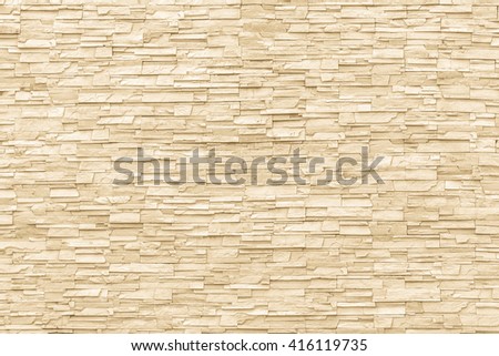 White yellow cream beige rock stone brick tile wall aged texture detailed pattern background: Grunge ancient rustic limestone stonework block masonry patterned backdrop for architectural decoration
