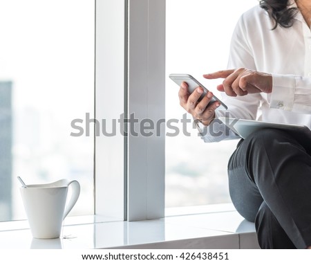 City lifestyle journalist blogger woman working on computer device, smart phone texting in home office: Hand keyboard typing: People w/ wifi cyber IT IOT IM PPC communication technology daily life seo