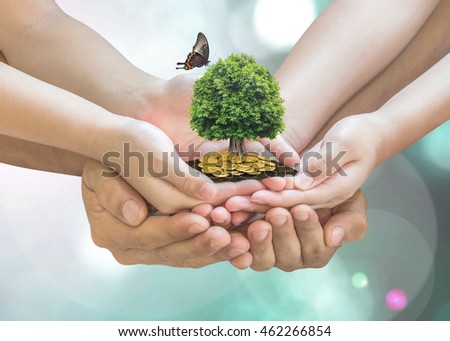 Parent and children planting together big tree with butterfly on family hands on gold coins soil ground: Retirement planning, financial investing, eco bio arbor CSR ESG ecosystem reforestation concept
