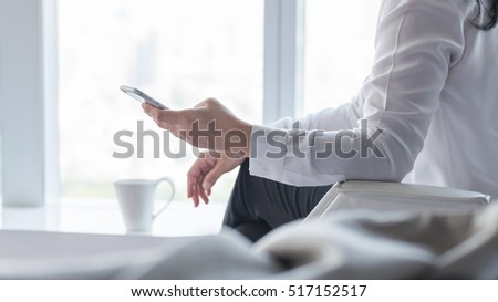 City lifestyle journalist blogger woman working on smartphone application texting in home office: Hand keyboard typing: People work wifi cyber IT IOT IM PPC communication technology daily life seo