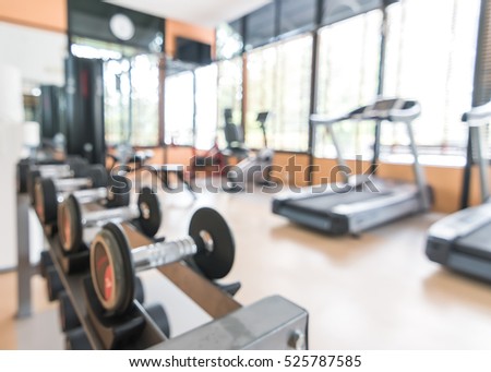 Blur abstract background modern fitness center lifestyle with health exercise equipment: Blurry perspective view gym facility service room: Empty gymnasium indoor space for diet, bodybuilding training