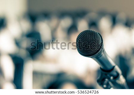 Microphone soft focus on blur abstract background lecture hall/ seminar meeting room in business event/ educational academic classroom training course: Speaker / teacher\'s mic in college class room