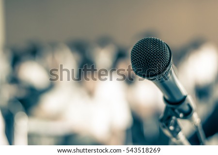 Microphone soft focus on blur abstract background lecture hall/ seminar meeting room in business event educational academic classroom training course: Speaker / teacher\'s mic in college class room