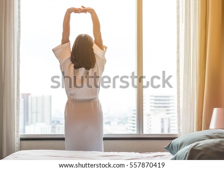 Adult woman practicing relaxation sitting in yoga lotus pose