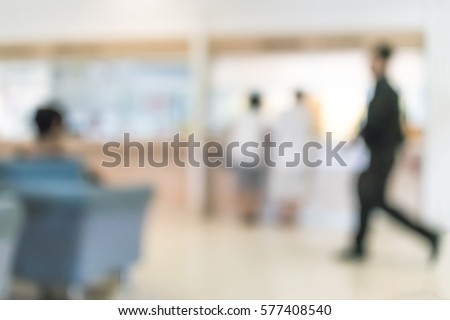 Blur abstract background reception hall customer or patient counter service cashier desk indoor space in hospital office hotel bank interior: Blurry perspective view information lobby staff working