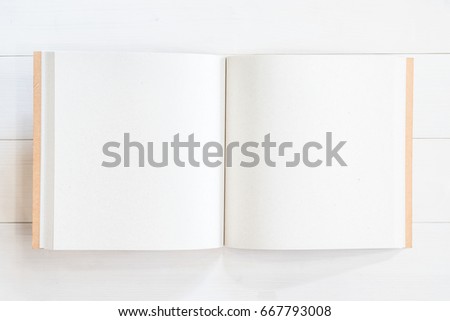 Blank book mock up template square-size recycle paper catalog or magazine with open pages on white wood table