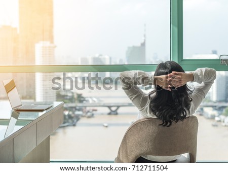 Life quality, living balance and carefree mental health concept with woman take it easy working and resting in luxury business city hotel or at home office with computer pc laptop on desk