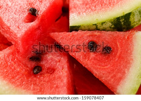 Freshly cut watermelon pieces with black seeds in it