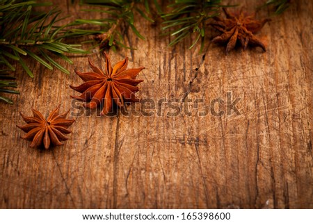 Star anise and branch on rustic wooden background, Christmas concept