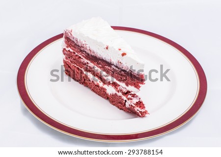 Red velvet cake is very dramatic looking with its bright red color sharply contrasted by a white cream