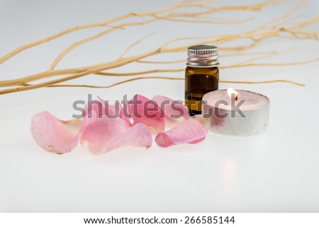 light pink rose,dry wood stick with tea light candle and aromatic essence