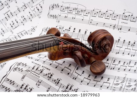 Violin on a pile of sheet music