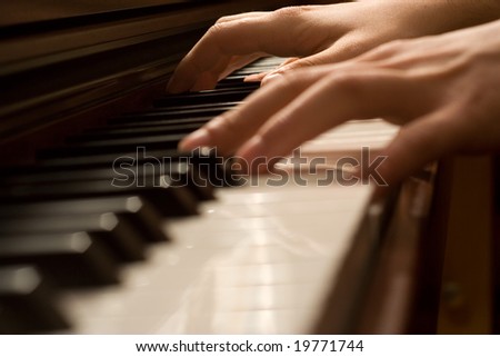 Pianists\' hand playing the piano
