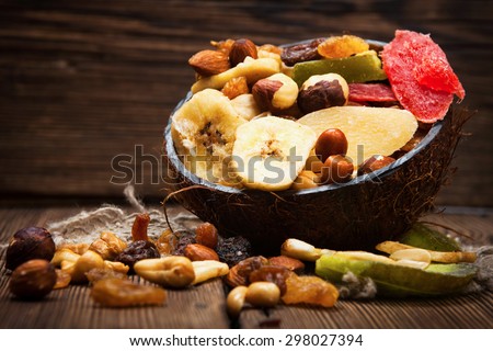 Dried fruits on wooden background