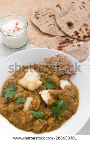 Fish curry meal with chapati flatbread