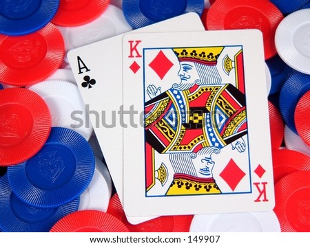 a blackjack hand on a pile of chips