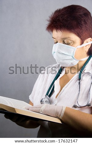 Female doctor reading a book