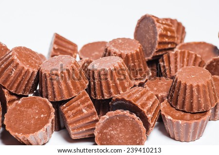 Chocolate peanut butter cups on white background
