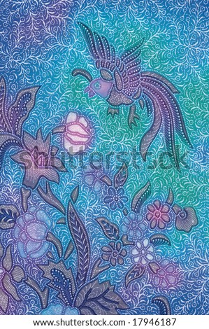 stock photo : Blue batik sarong with floral motif and a bird