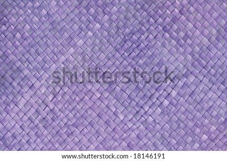 Purple texture of woven mat from palm leaf