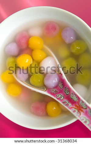 Thong Yin - traditional Chinese dessert of colorful glutinous rice balls in syrup