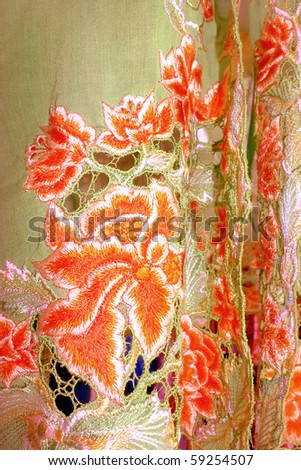 Beige Kebaya cloth With intricate embroidery of orange flowers
