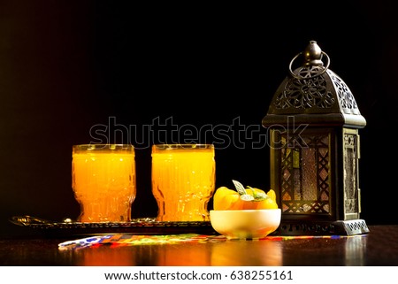 Table with Qamar El Din ( Apricots Juice) and Ramadan fanous (lantern) ready for happy breakfast in Ramadan