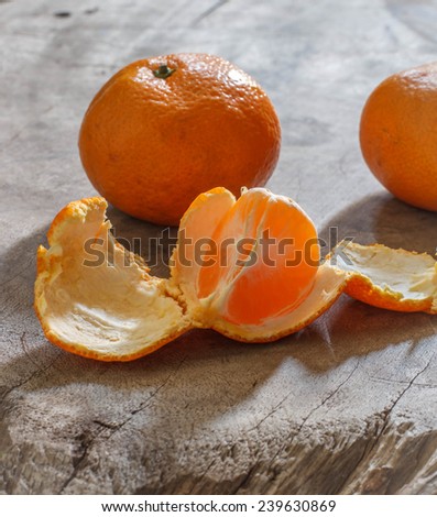 orange fruit still life image on wood