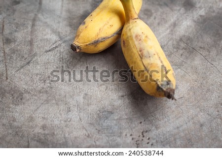 bunch of bananas on old wood