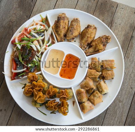 Fried pork dumplings wrapped, Fried chicken,preserved egg salad, food of thailand