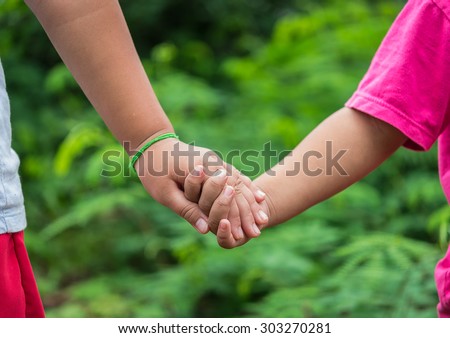 hands of children friends, summer nature outdoor,select focus