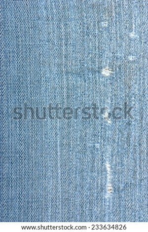 Close up of jeans that are old and torn.