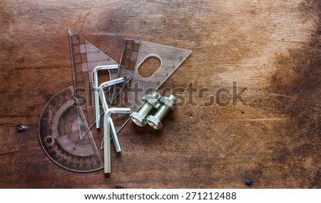 Device Manager - L-shaped wrench - Nutandbolt On old wooden background.