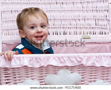 little boy out of the pink basket
