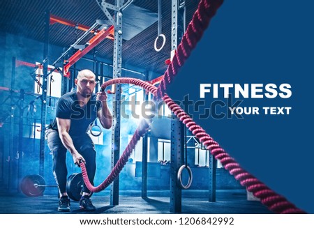 Men with battle rope battle ropes exercise in the fitness gym. CrossFit concept. gym, sport, rope, training, athlete, workout, exercises concept
