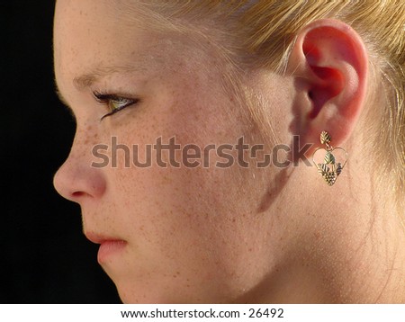 stock photo : Side view of a young woman's face.
