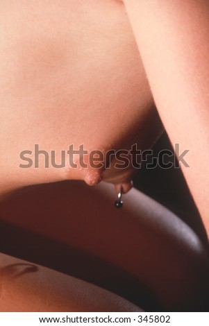 stock photo : Body pierced nipple with ring
