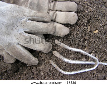 Worn gloves and tool