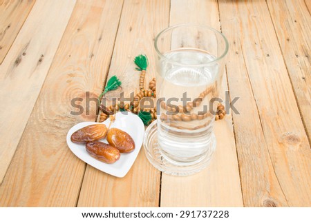 date palm on the wood Fasting is obligatory for adult Muslim in Ramadan Muslim will breaking their fasting after sundown with a date palm or with water to following the tradition date palm on the wood Fasting is obligatory for adult Muslim in Ramadan Muslim will breaking their fasting after sundown with a date palm or with water to following the tradition