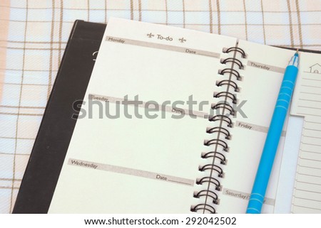 blank old phone book on textured cloth background