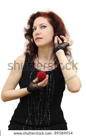 Young beautiful brunette lady trying on a pearl earring, the jewel box in another hand, isolated on white