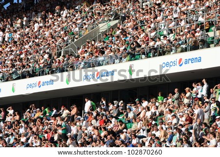 WARSAW, POLAND - APRIL 29: Fanatical fans of Legia during the league football match between Legia Warsaw vs Jagiellonia Bialystok on April 29, 2012 in Warsaw, Poland. Final results: 1:1