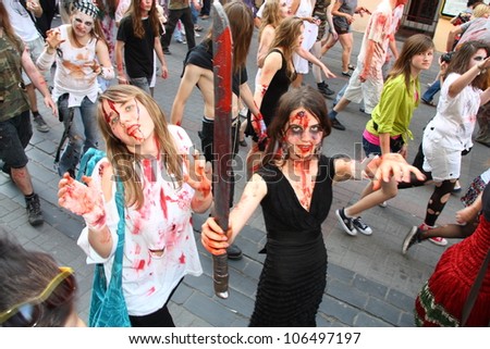 WARSAW, POLAND - JUNE 30: Zombie Walk 2012. Hundreds of young people dressed as Walking Dead meet every year in this zombie costume party in the streets of Warsaw, on June 30, 2012 in Warsaw, Poland.