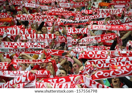 WARSAW, POLAND - SEPTEMBER 6: Unidentified Polish football fans the 2014 World Cup qualification football match between Poland and Montenegro on September 6, 2013 in Warsaw, Poland.
