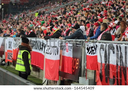 POZNAN, POLAND - NOVEMBER 19: Football fans of Poland during friendly football match between Poland and Ireland on November 19, 2013 in Poznan, Poland.