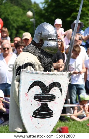 WARSAW, POLAND - JUNE 6: Struggle medieval knight during XV Knight Tournament on June 6, 2010 in Warsaw, Poland.