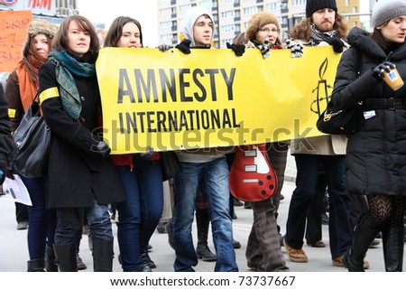 WARSAW, POLAND - MARCH 6: Unidentified members of Amnesty International take part in a  feminist demonstration in Warsaw, on March 6, 2011 in Warsaw, Poland.